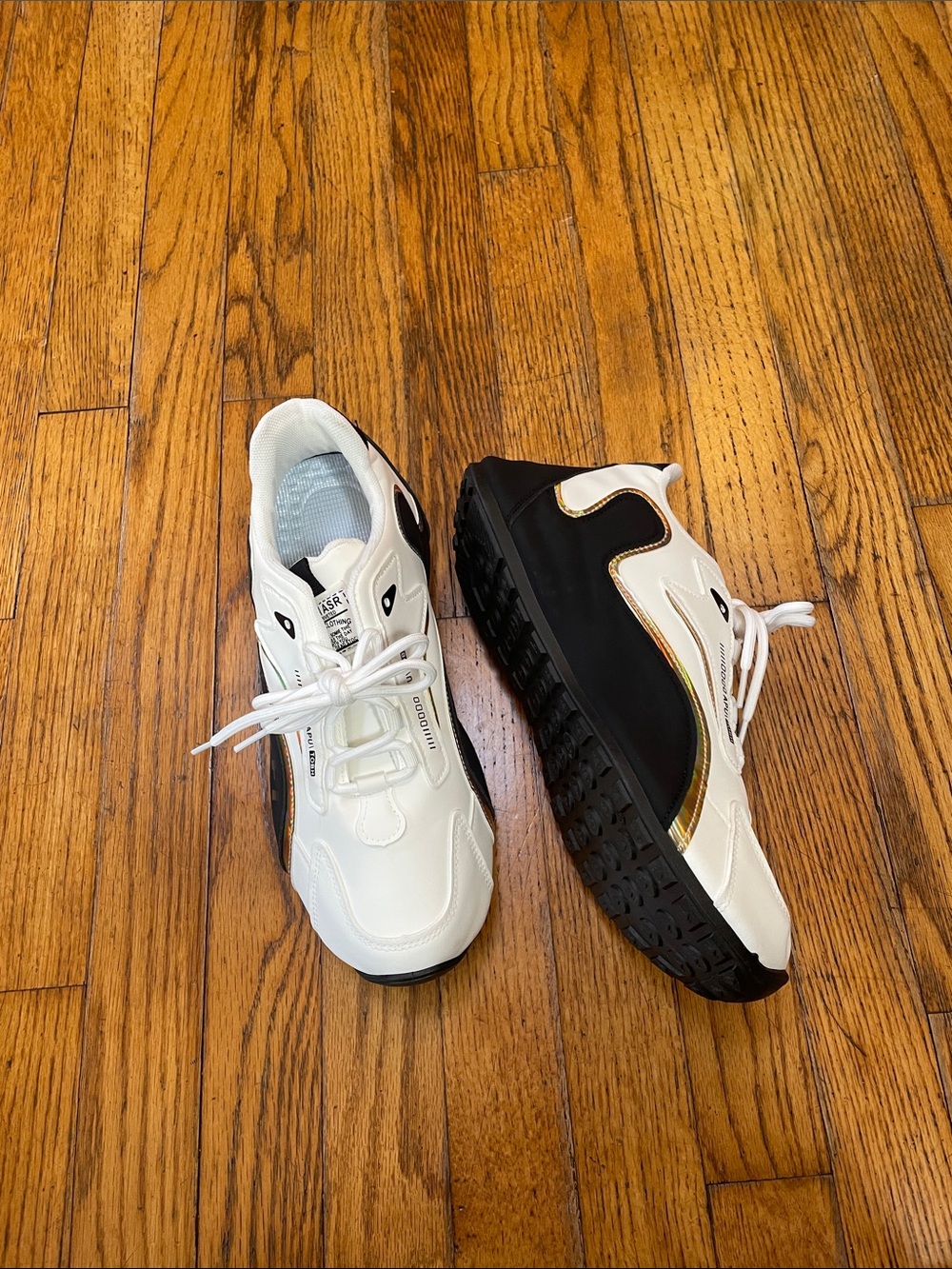 Woman’s White and Black Athletic Sneakers with Gold Accent